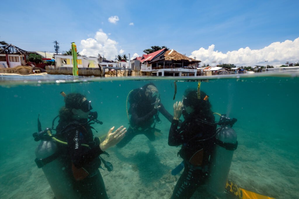 Open Water students take their lessons in the shallow area of Panagsama beach